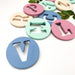 AlphaBET Chews Silicone Letter Teething Disc - Teethers - ONE.CHEW.THREE Boutique teething, modern accessories
